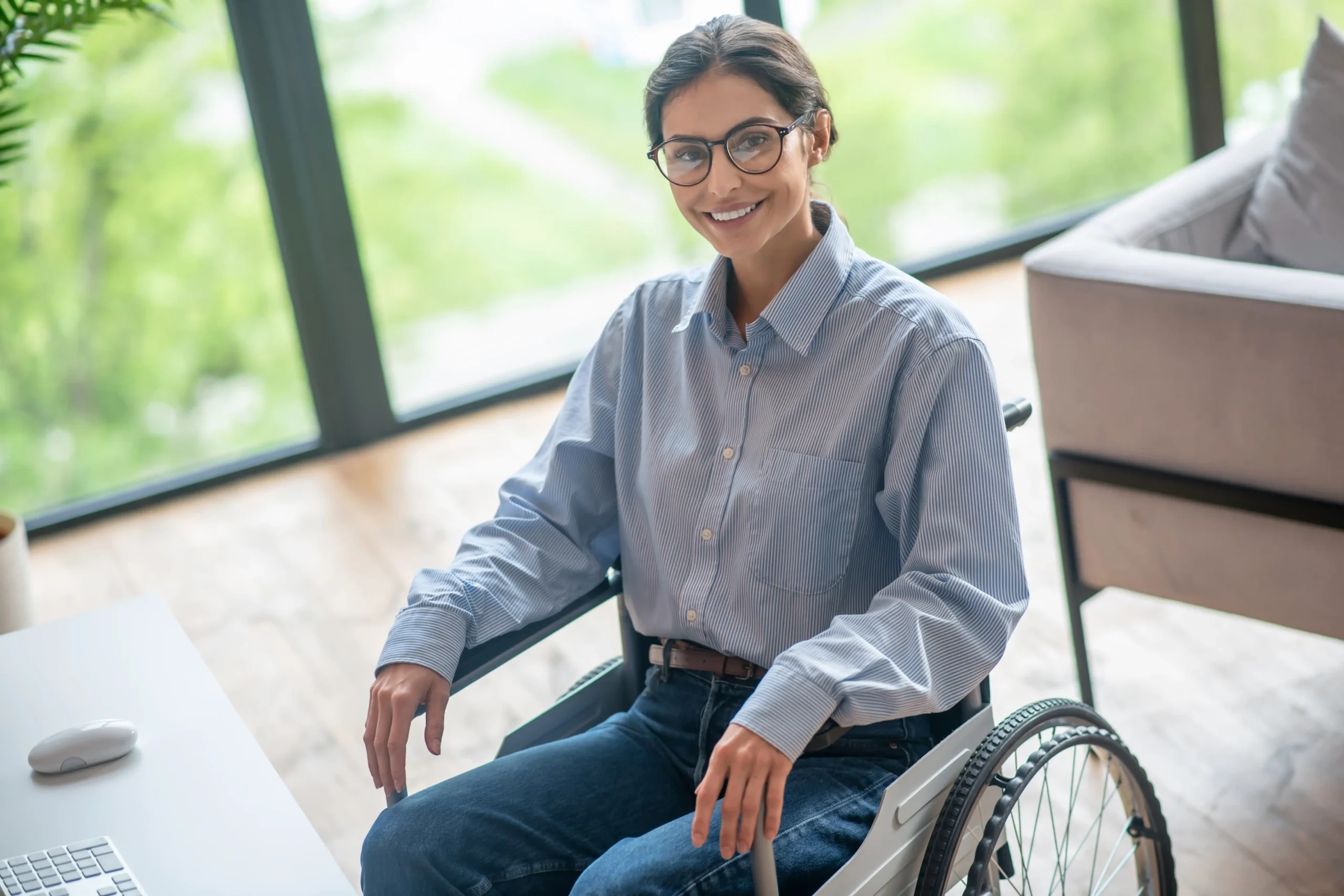 A disabled young woman wearing an adaptive classic button up shirt
